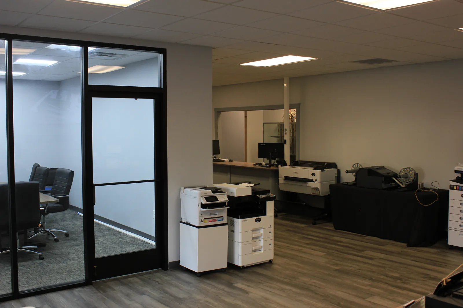 Glass-walled conference room entrance inside CTi Tech Plaza in Jackson, MI
