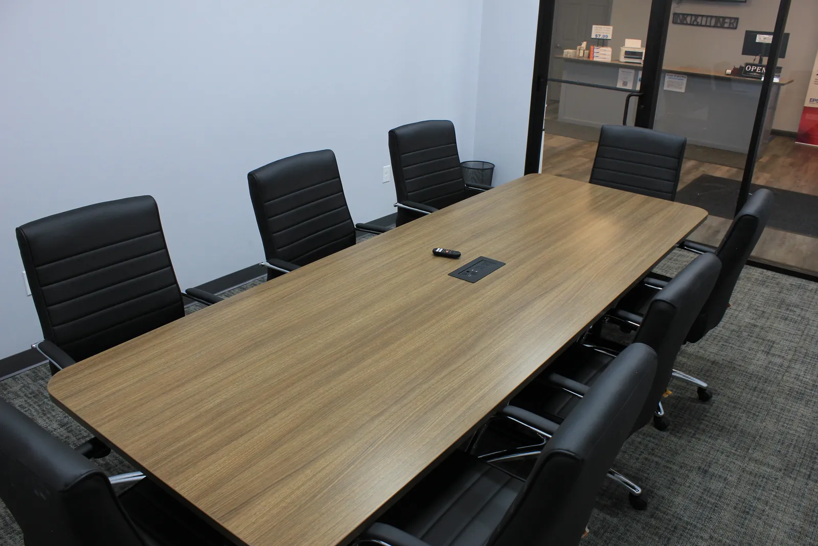 CTi Tech Plaza conference room with a long meeting table and black chairs