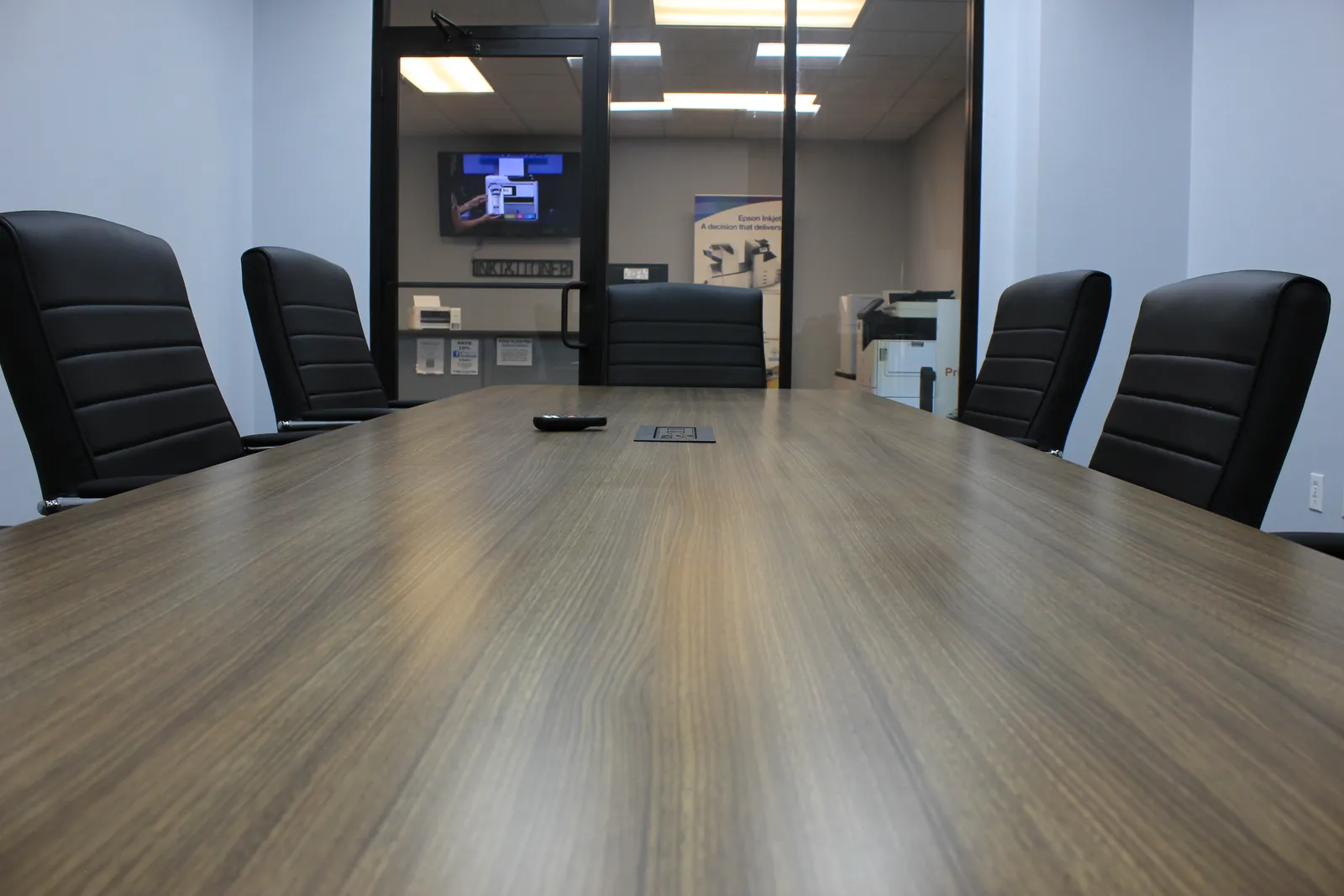 Wide view of the CTi Tech Plaza conference room table and chairs