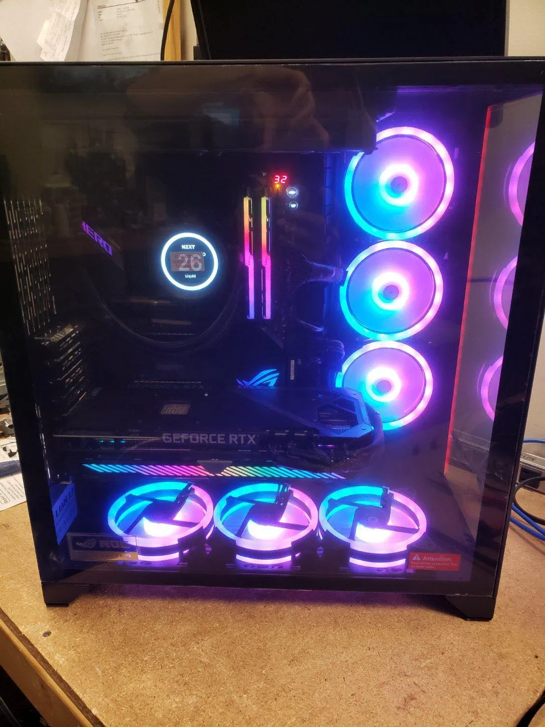 Custom PC build with blue and pink RGB cooling fans